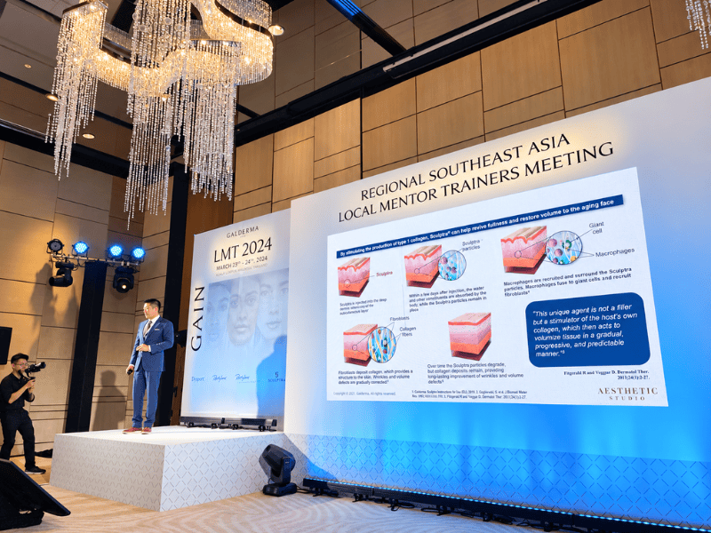 Dr. Jonathan Lee presenting at a medical aesthetics conference